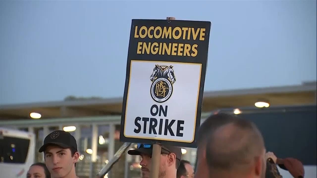 Image for article: <b>Workers</b> form picket lines as <b>strike</b> shuts down the largest US commuter rail system