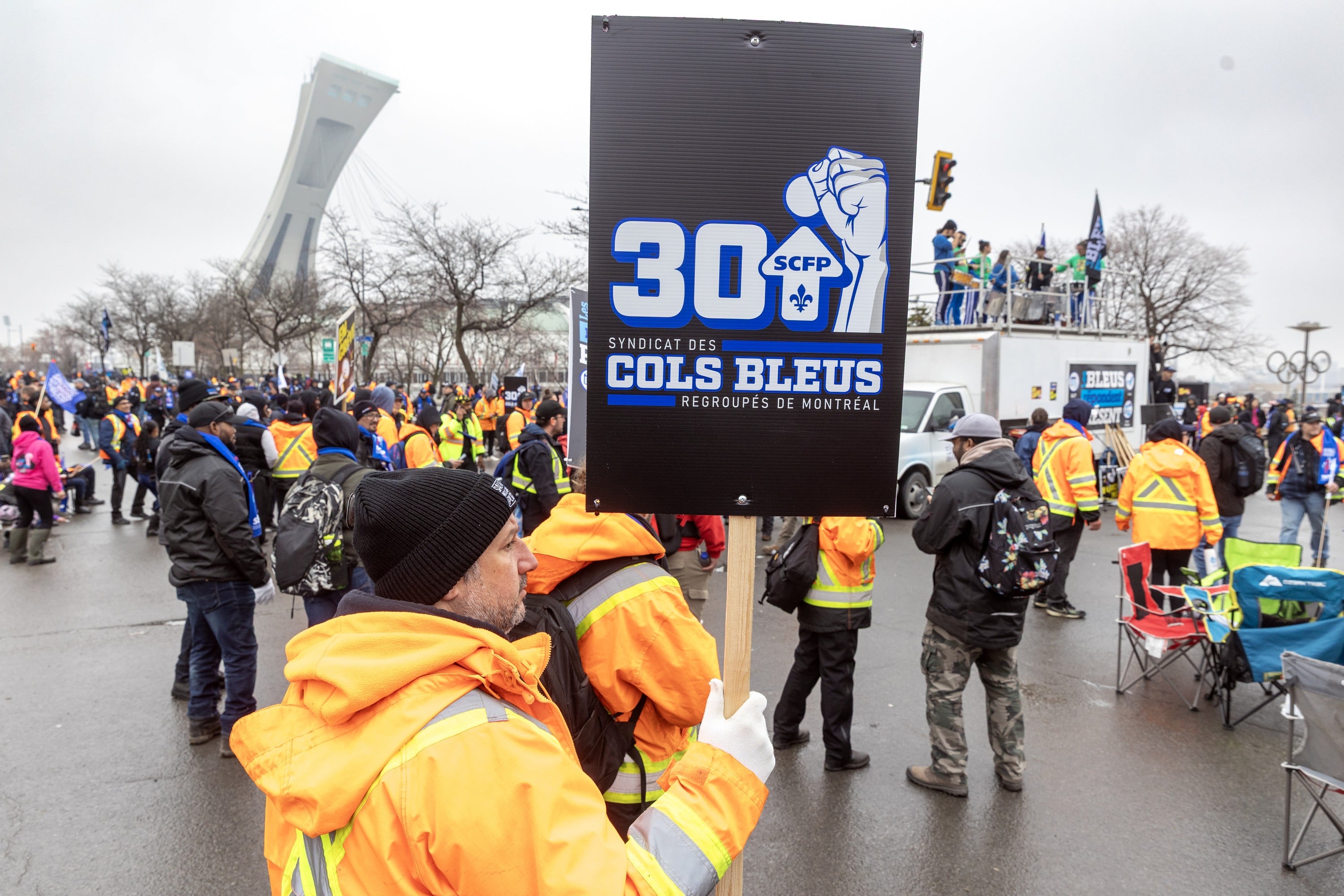 Image for article: Striking blue-collar workers block Sherbrooke St. during morning rush hour